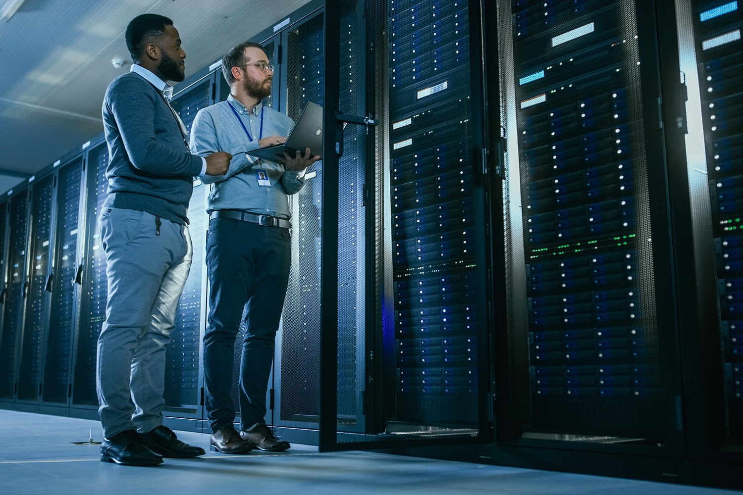 Two it technicians in a data center